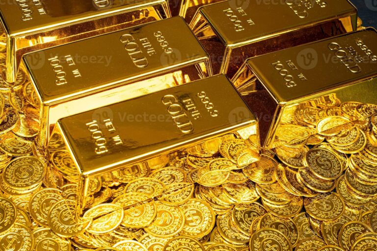 gold-bars-are-placed-on-a-pile-of-gold-coins-photo